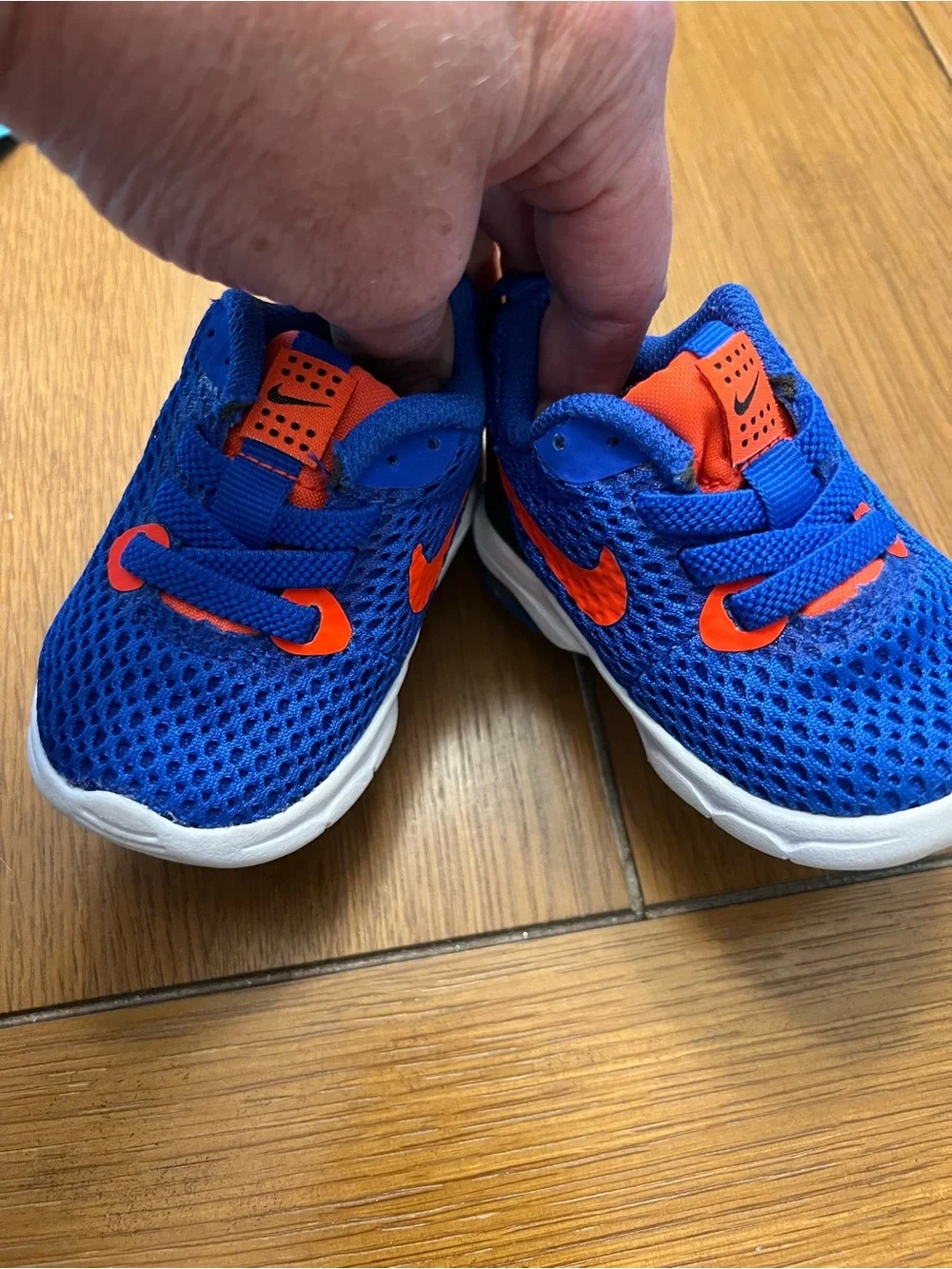 Nike Air Kids Blue Sneakers with Bright Orange Swoosh
